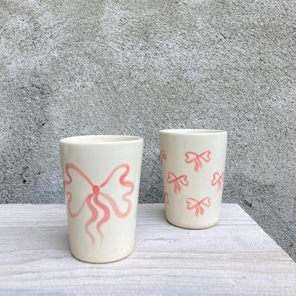 Ceramic cup with pink bow