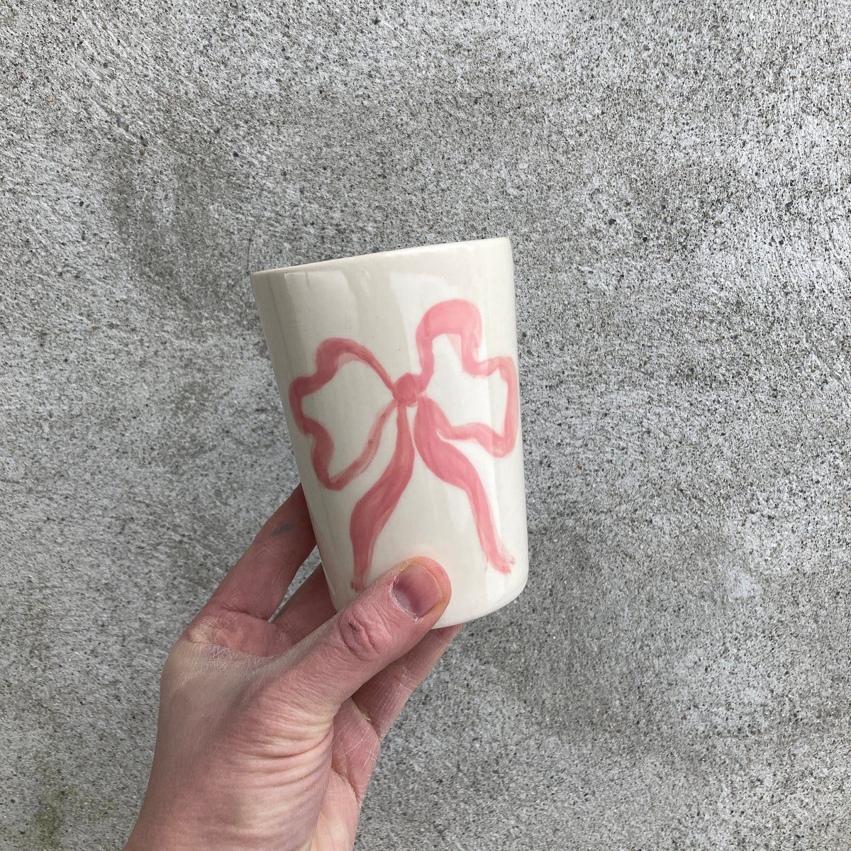 Ceramic cup with pink bow