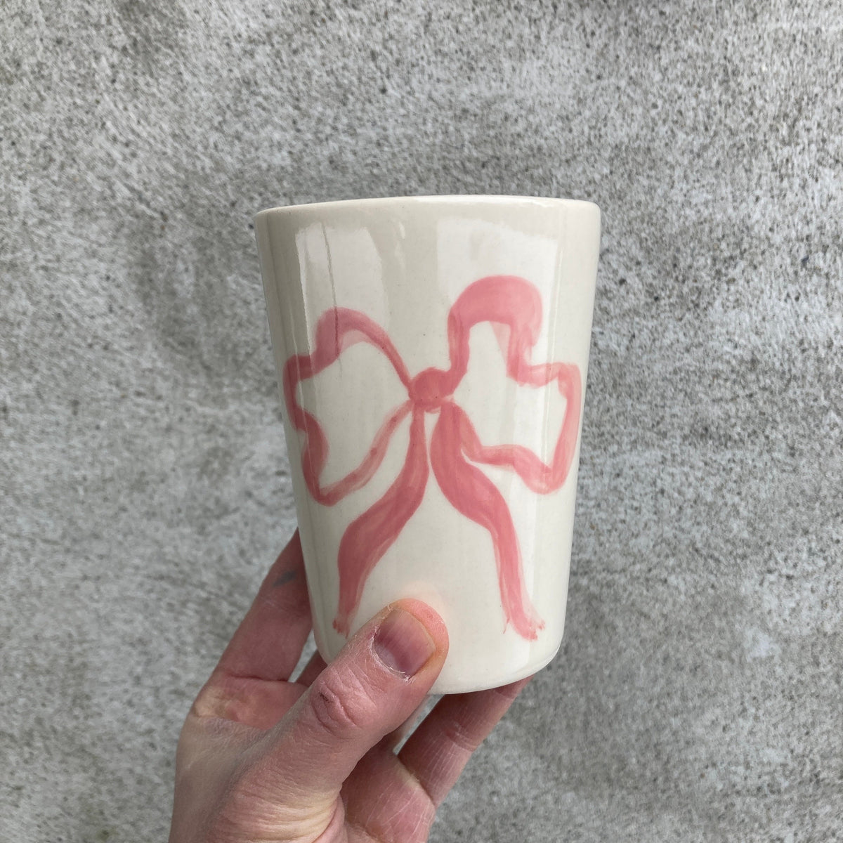 Ceramic cup with pink bow