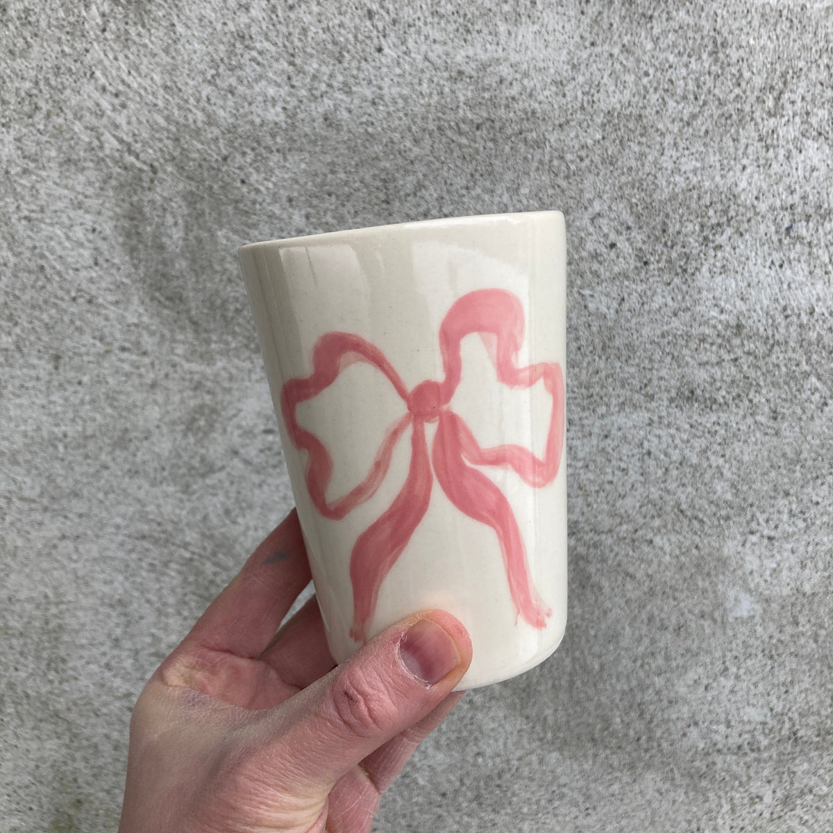 Ceramic cup with pink bow