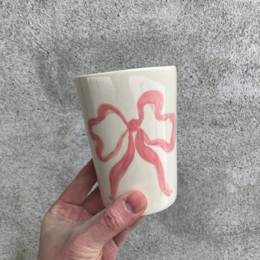 Ceramic cup with pink bow
