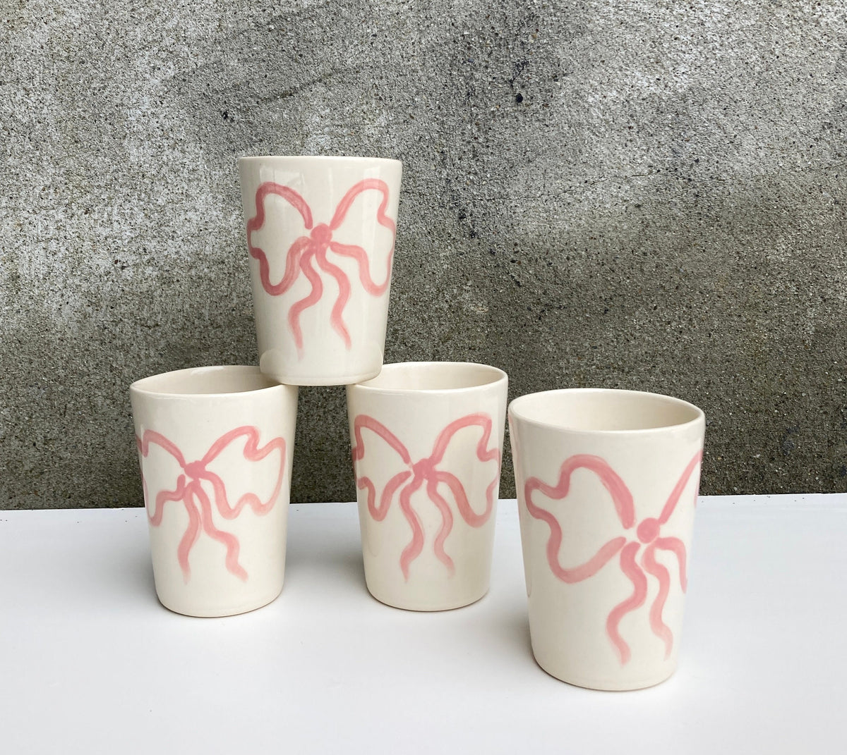 Ceramic cup with pink bow