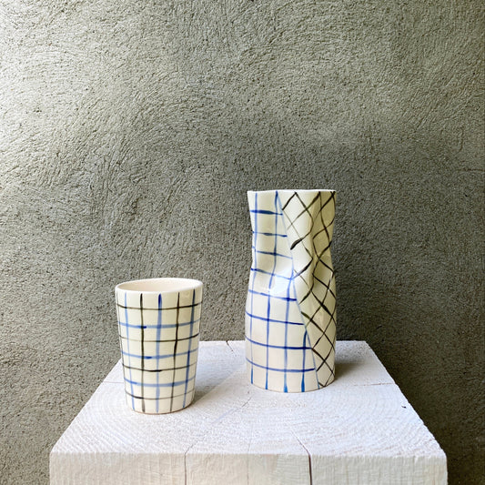 Ceramic cup with blue and black grid