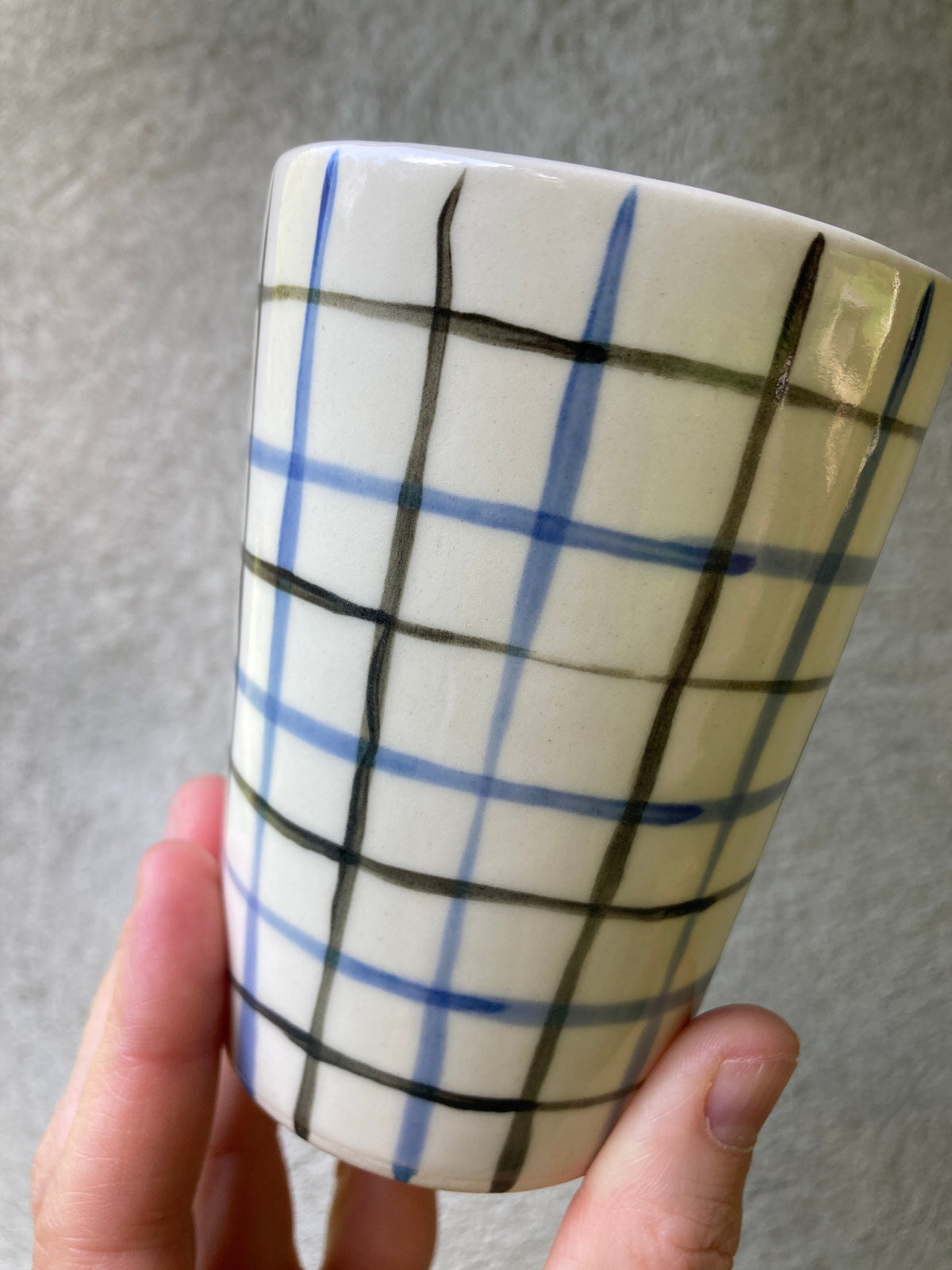 Ceramic cup with blue and black grid