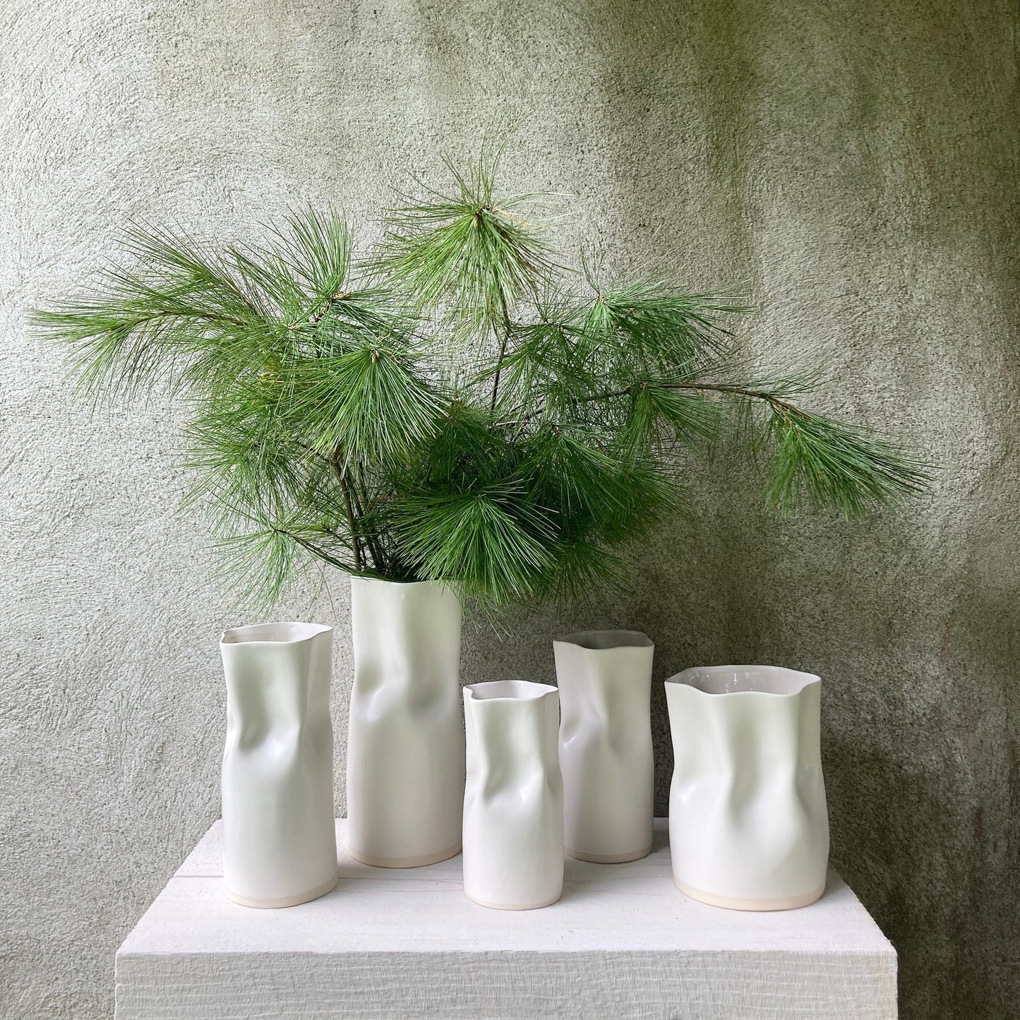 Ceramic pinched white vase with satin finish