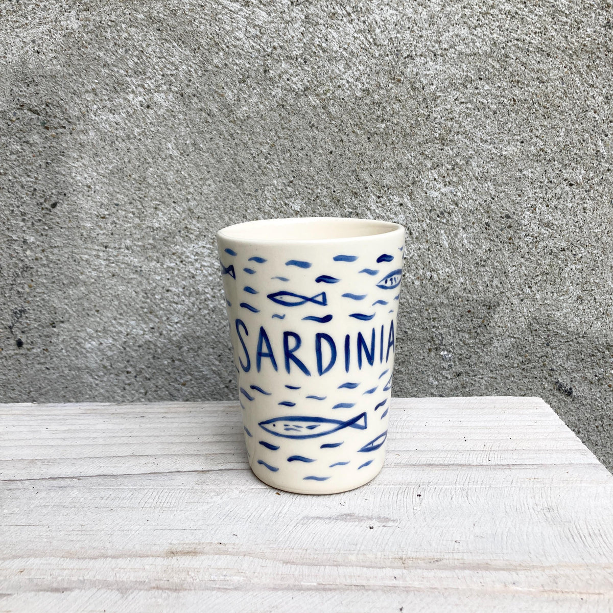 Ceramic cup with sardines, all over fish pattern