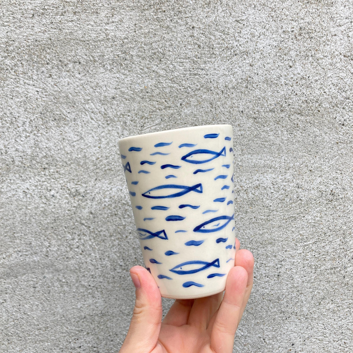 Ceramic cup with sardines, all over fish pattern