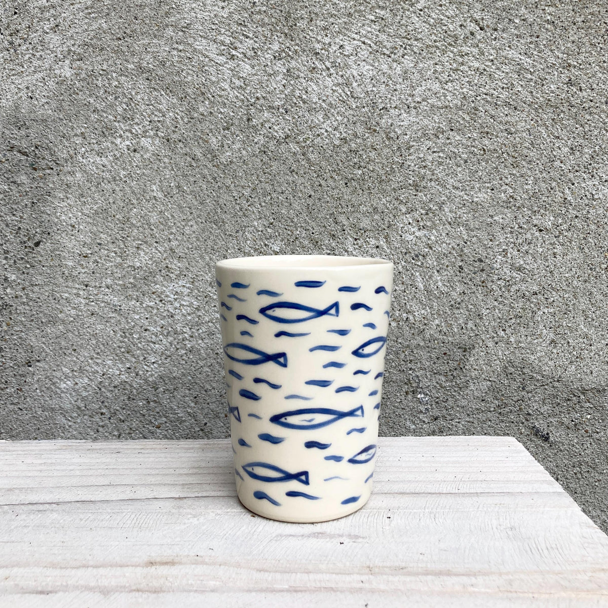 Ceramic cup with sardines, all over fish pattern