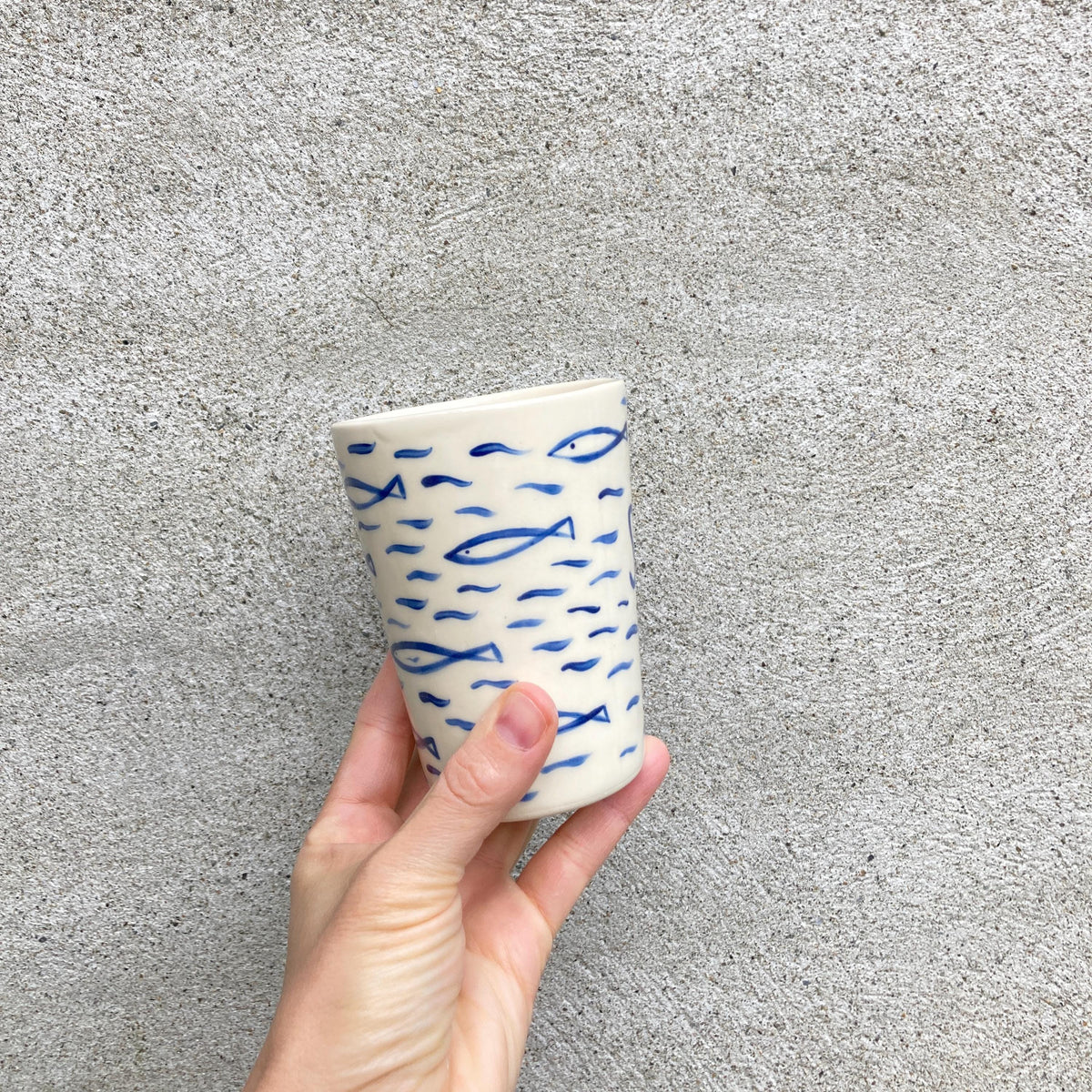 Ceramic cup with sardines, all over fish pattern